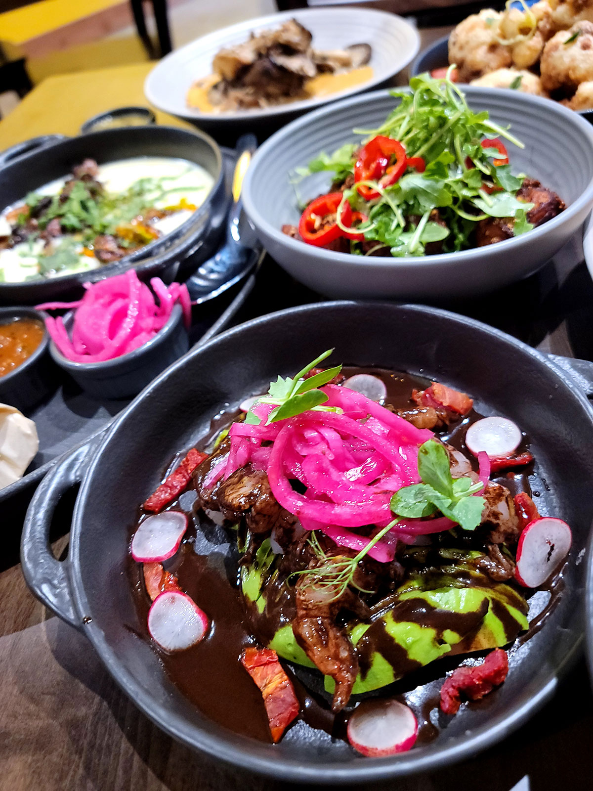 Various pleated bowl dishes with vegetables